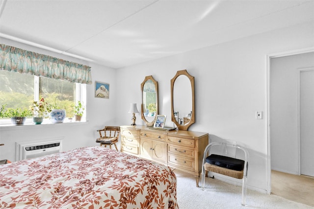 carpeted bedroom featuring a wall unit AC