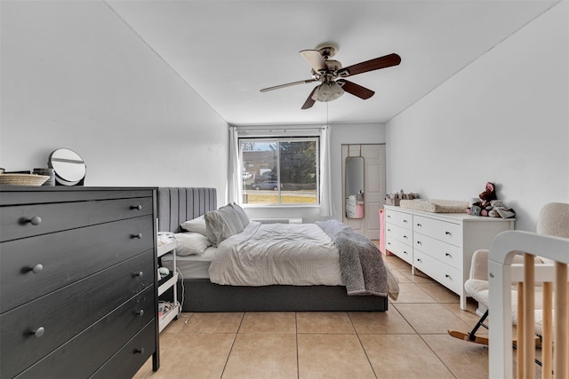 bedroom with light tile patterned floors and ceiling fan