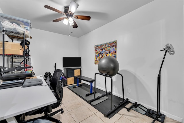 office space with light tile patterned flooring, baseboards, and ceiling fan