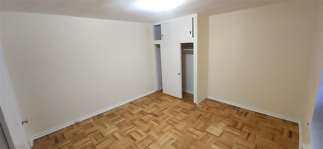 unfurnished bedroom featuring a closet and baseboards