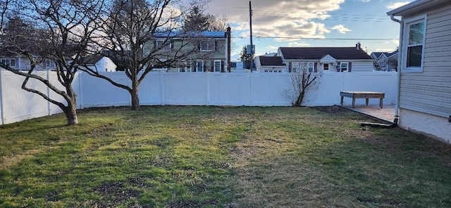 view of yard with a fenced backyard