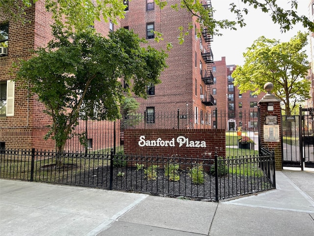 community sign with fence