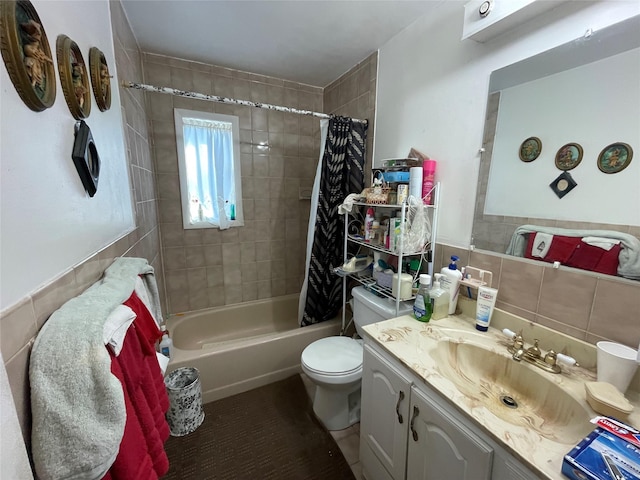 bathroom with tile walls, toilet, shower / tub combo with curtain, decorative backsplash, and vanity