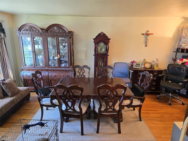 dining area with wood finished floors