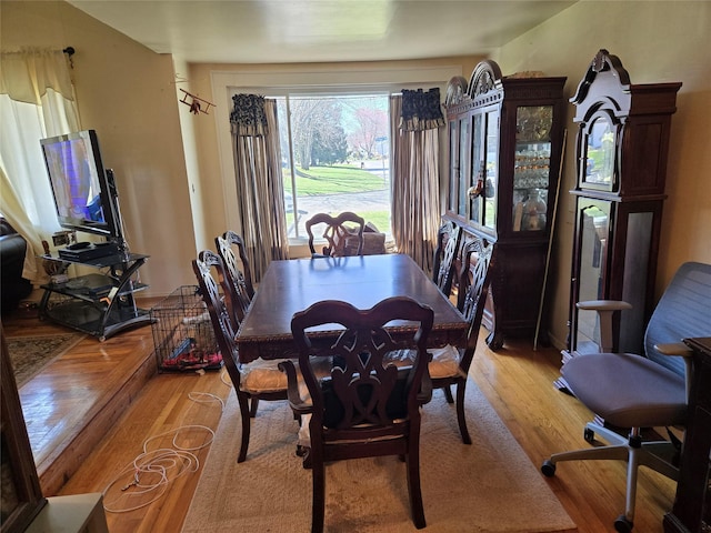 dining area featuring light wood-style flooring