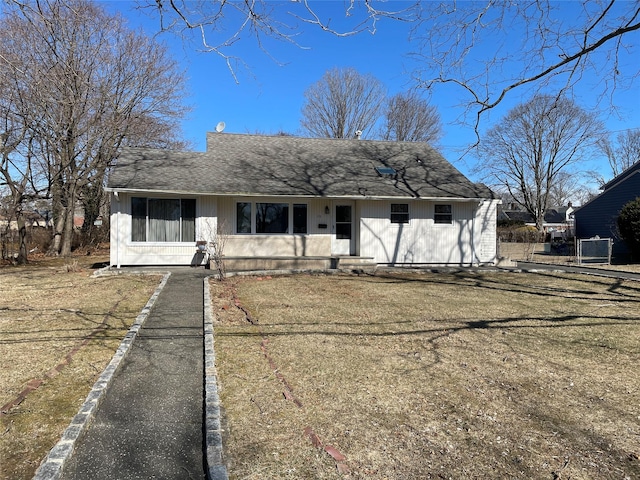 bungalow-style home featuring a shingled roof
