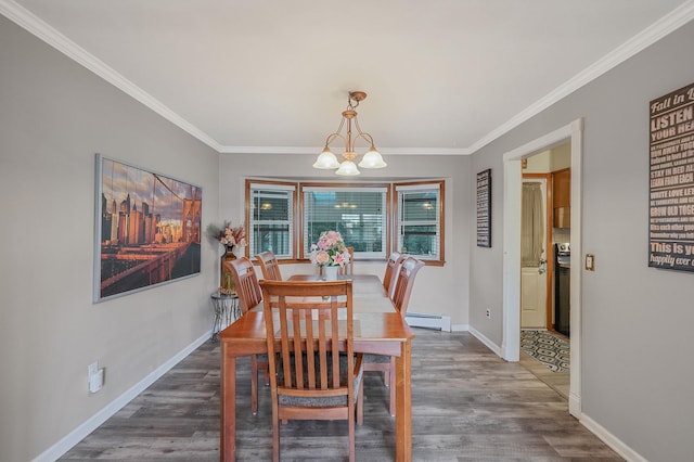 dining room with a baseboard radiator, baseboards, wood finished floors, and a chandelier