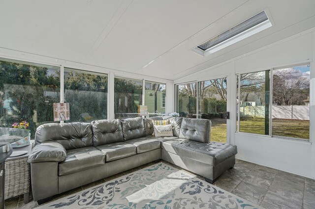 sunroom with lofted ceiling with skylight