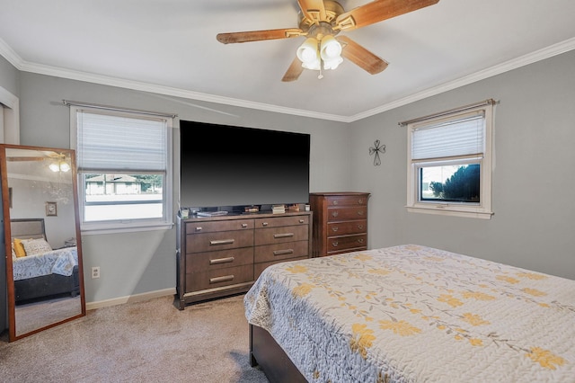 bedroom with a ceiling fan, baseboards, light colored carpet, and crown molding