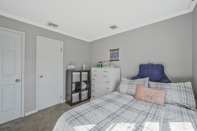 carpeted bedroom with visible vents and crown molding