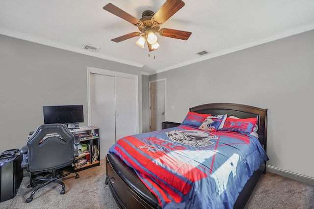 bedroom featuring a closet, visible vents, crown molding, and carpet floors