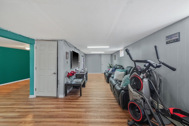 interior space with baseboards and light wood-style flooring