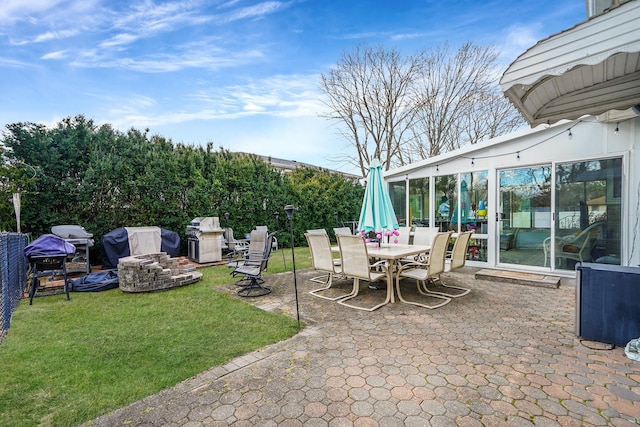 view of patio / terrace featuring grilling area and fence