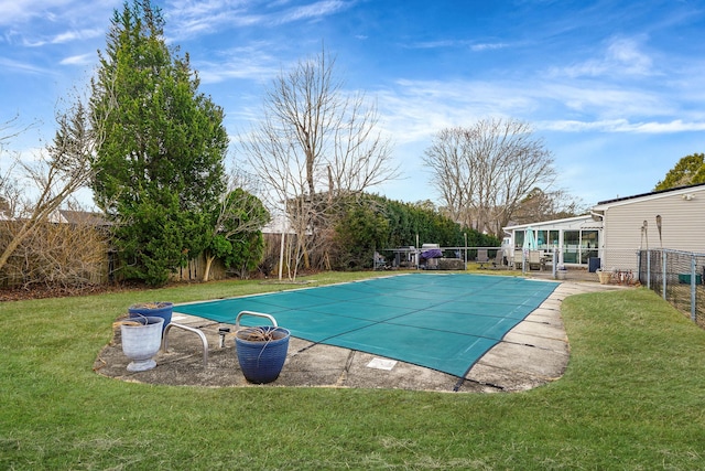 view of pool featuring a yard, a patio area, a fenced in pool, and a fenced backyard