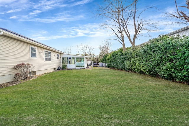 view of yard with a sunroom