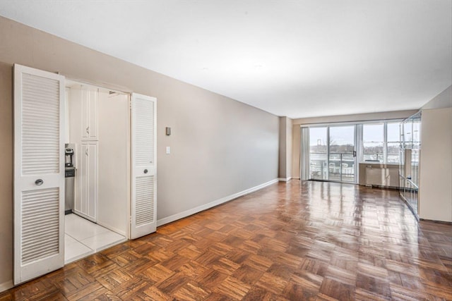 empty room with baseboards