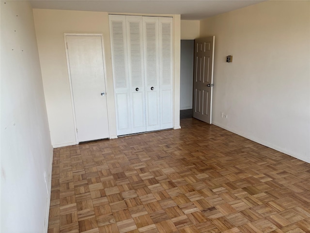 17-85 215th St Unit 5A, Bayside, NY 11360 - unfurnished bedroom with a closet and baseboards