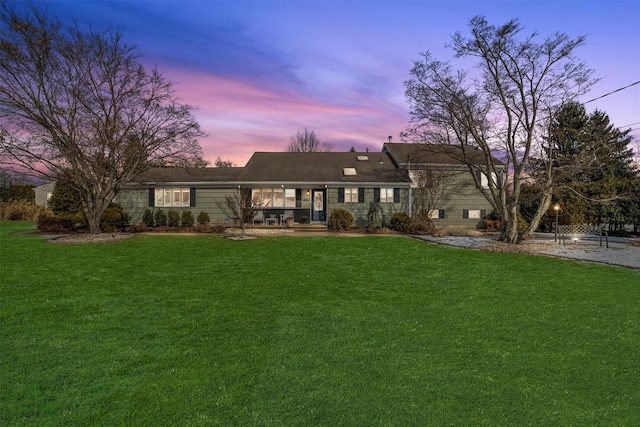 view of front of home with a front lawn