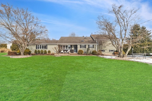 rear view of house with a lawn