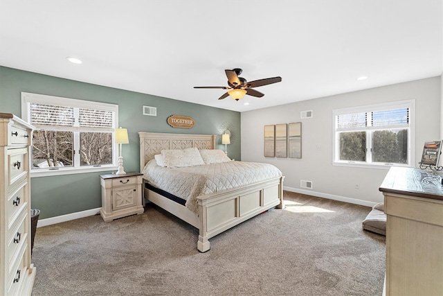 carpeted bedroom with visible vents and baseboards