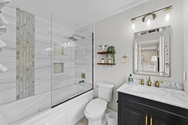 full bathroom with vanity, toilet, and bath / shower combo with glass door