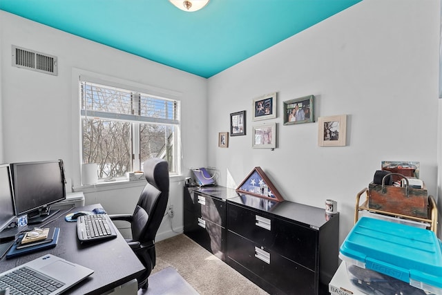 carpeted home office featuring baseboards and visible vents