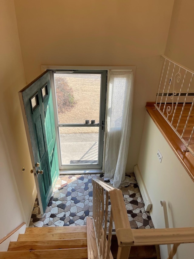 foyer entrance featuring vaulted ceiling