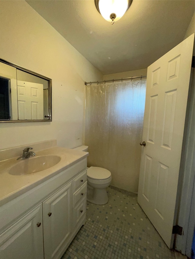 full bath with toilet and vanity