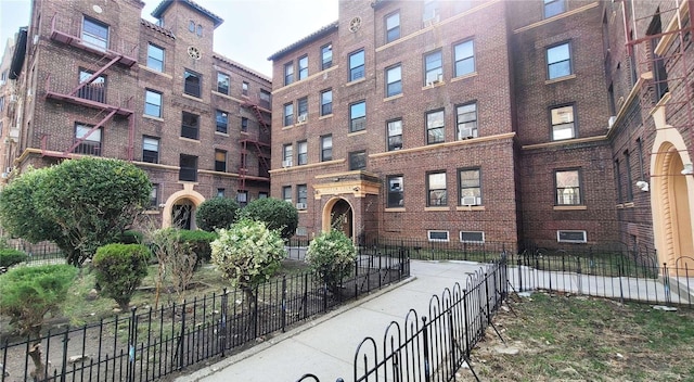 view of building exterior with fence