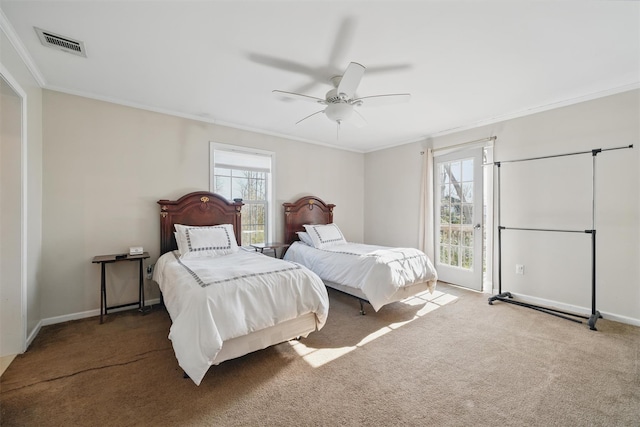 bedroom with crown molding, multiple windows, and visible vents