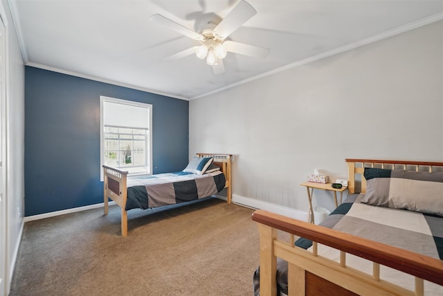 carpeted bedroom with crown molding, baseboards, and ceiling fan