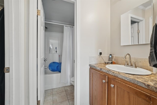 bathroom featuring tile patterned flooring, vanity, toilet, shower / tub combo with curtain, and ornamental molding