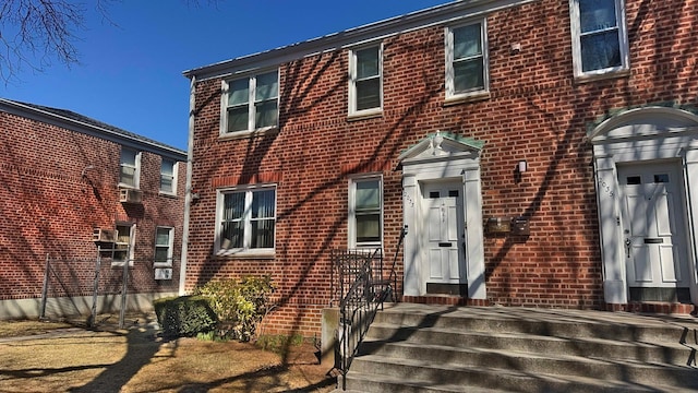 view of front of property featuring brick siding