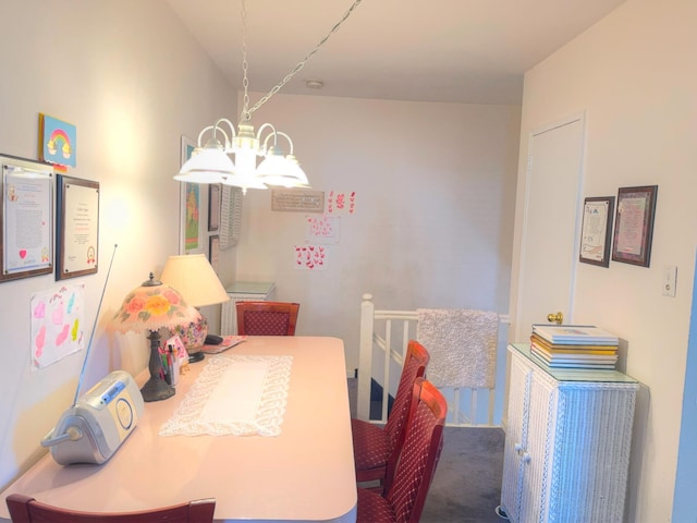 carpeted dining room featuring an inviting chandelier