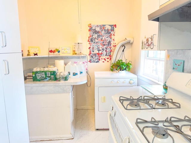 kitchen featuring white range with gas cooktop, washer / clothes dryer, light countertops, under cabinet range hood, and marble finish floor