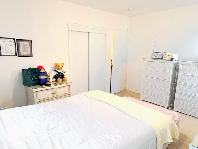 carpeted bedroom featuring a closet