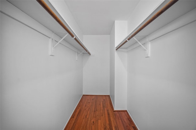 spacious closet with wood finished floors