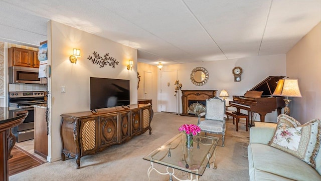 carpeted living room with a fireplace