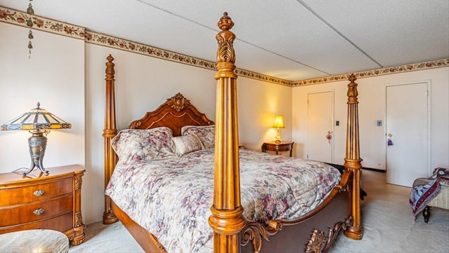 carpeted bedroom with a textured ceiling