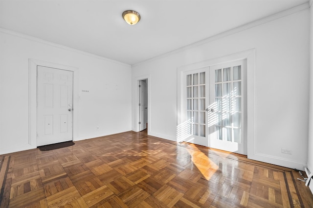 spare room featuring baseboards and ornamental molding