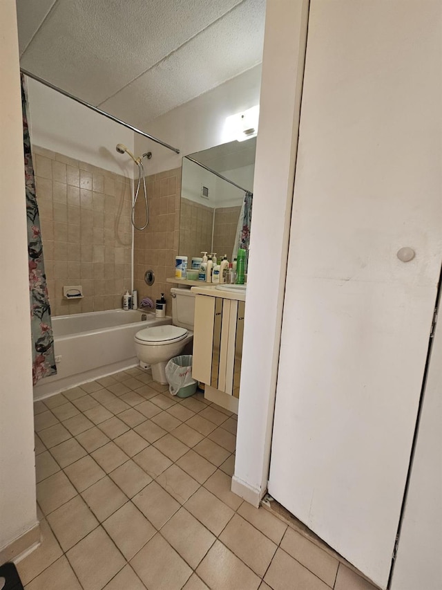 bathroom with tile patterned flooring, toilet, shower / tub combo with curtain, a textured ceiling, and vanity