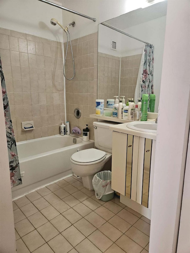 full bathroom with visible vents, toilet, shower / tub combo, tile patterned floors, and vanity