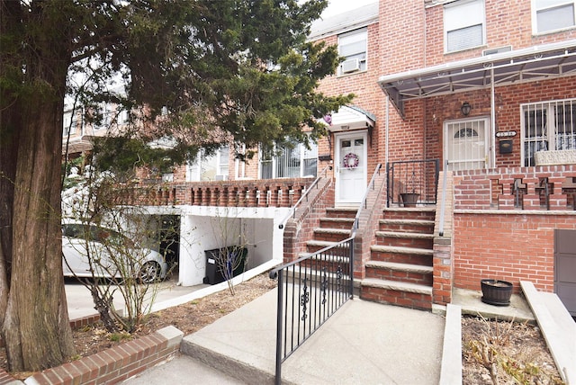 property entrance with brick siding