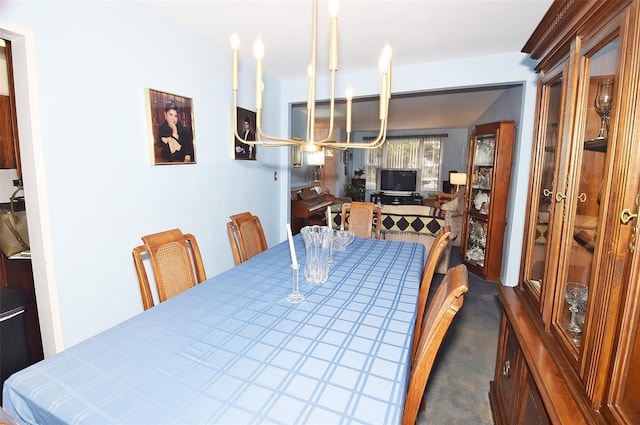 dining space featuring dark colored carpet