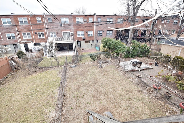 exterior space with cooling unit and a fenced backyard