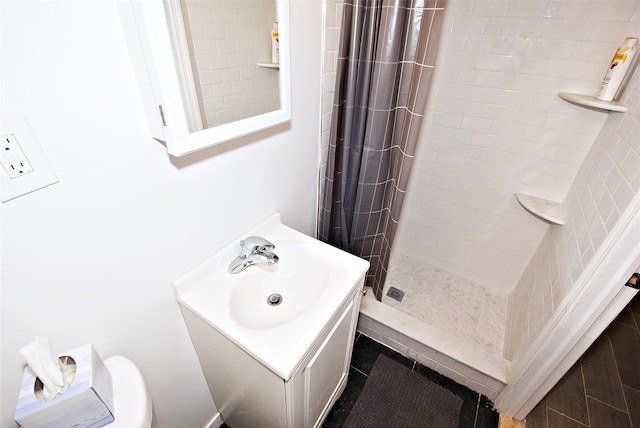 full bathroom featuring vanity and a shower stall