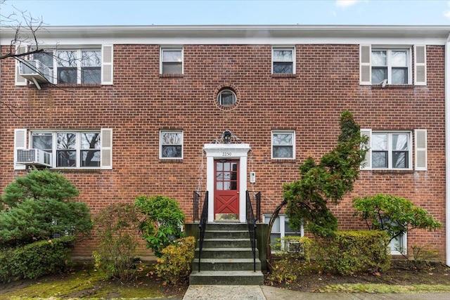 view of front of house featuring brick siding