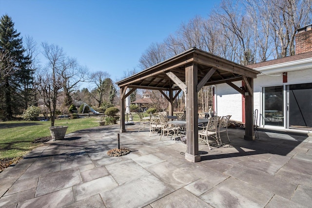 view of patio with a gazebo and outdoor dining space