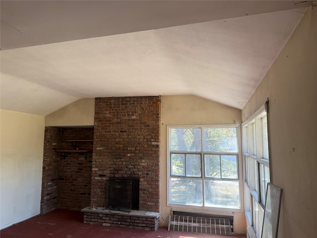 unfurnished living room featuring lofted ceiling, radiator heating unit, and a fireplace