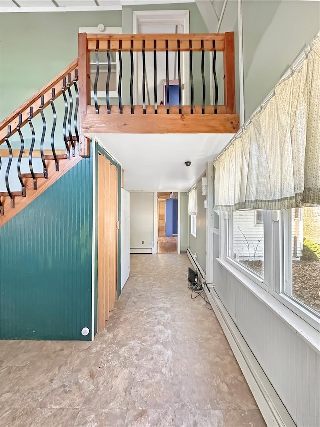 stairs featuring a baseboard radiator